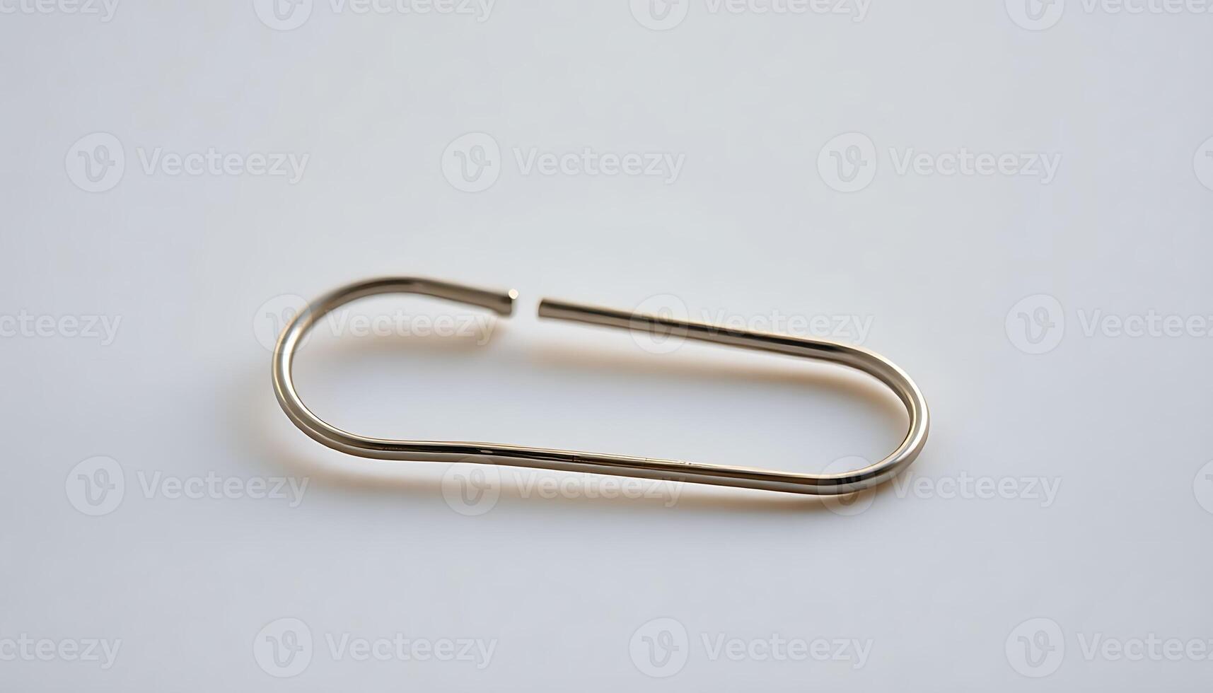 close up of a metal hook on a white surface photo