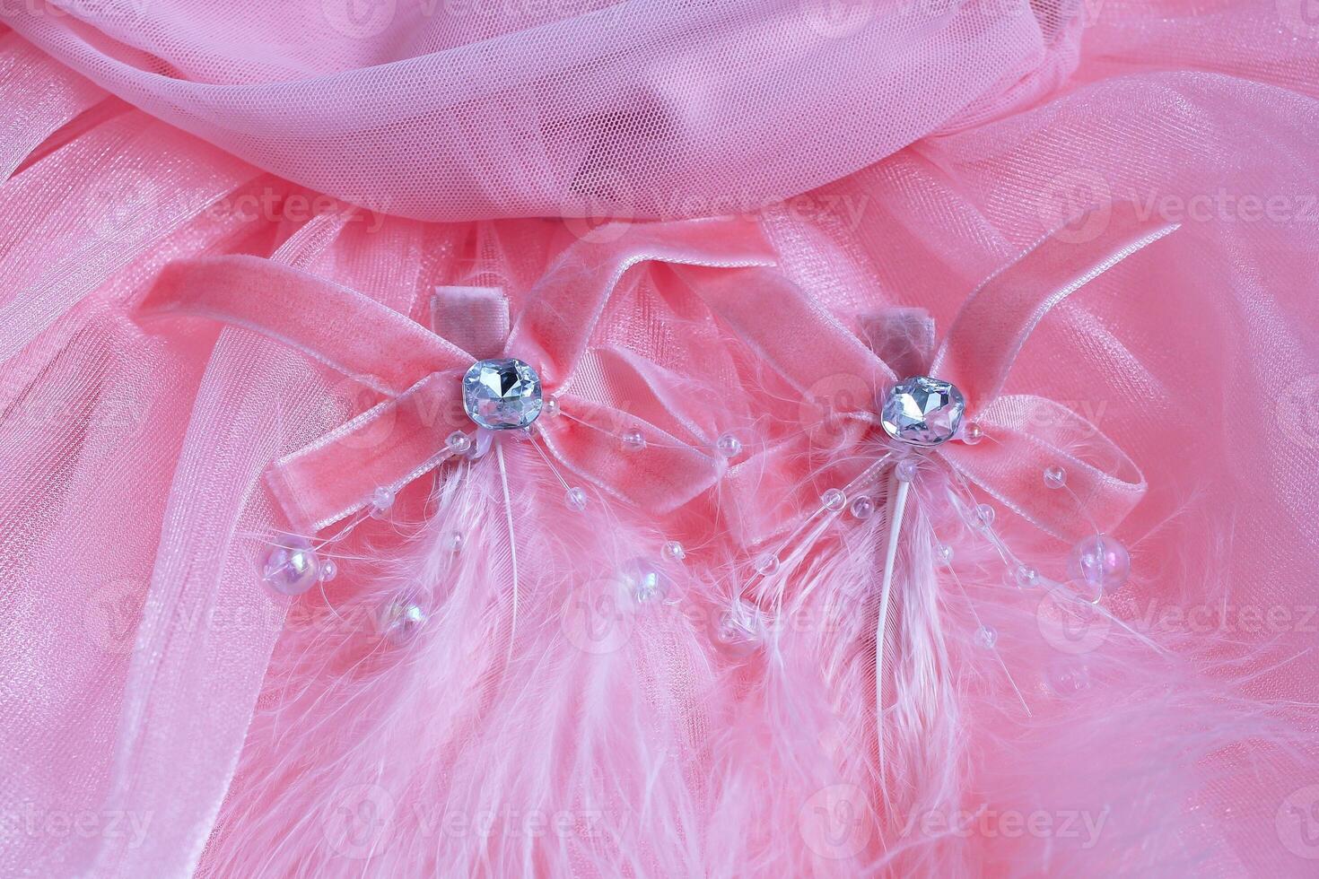 Delicate Pink Decorations Elegant Fabric Adornments with Feathers and Sparkling Jewels for Fashion. photo