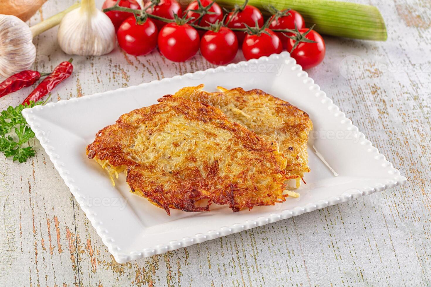 A plate of food with potatoes and vegetables photo