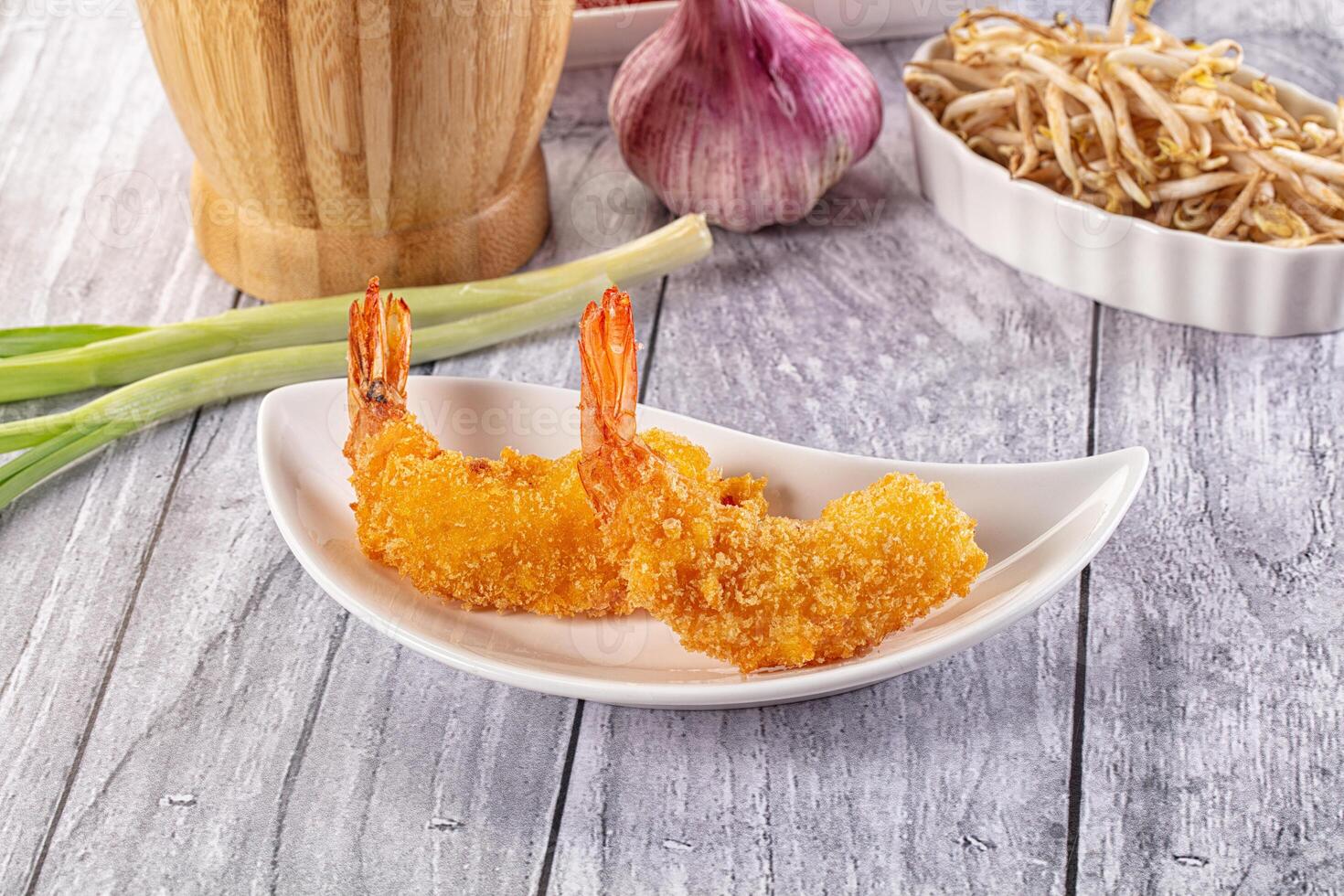 A plate of shrimp and a bowl of noodles photo