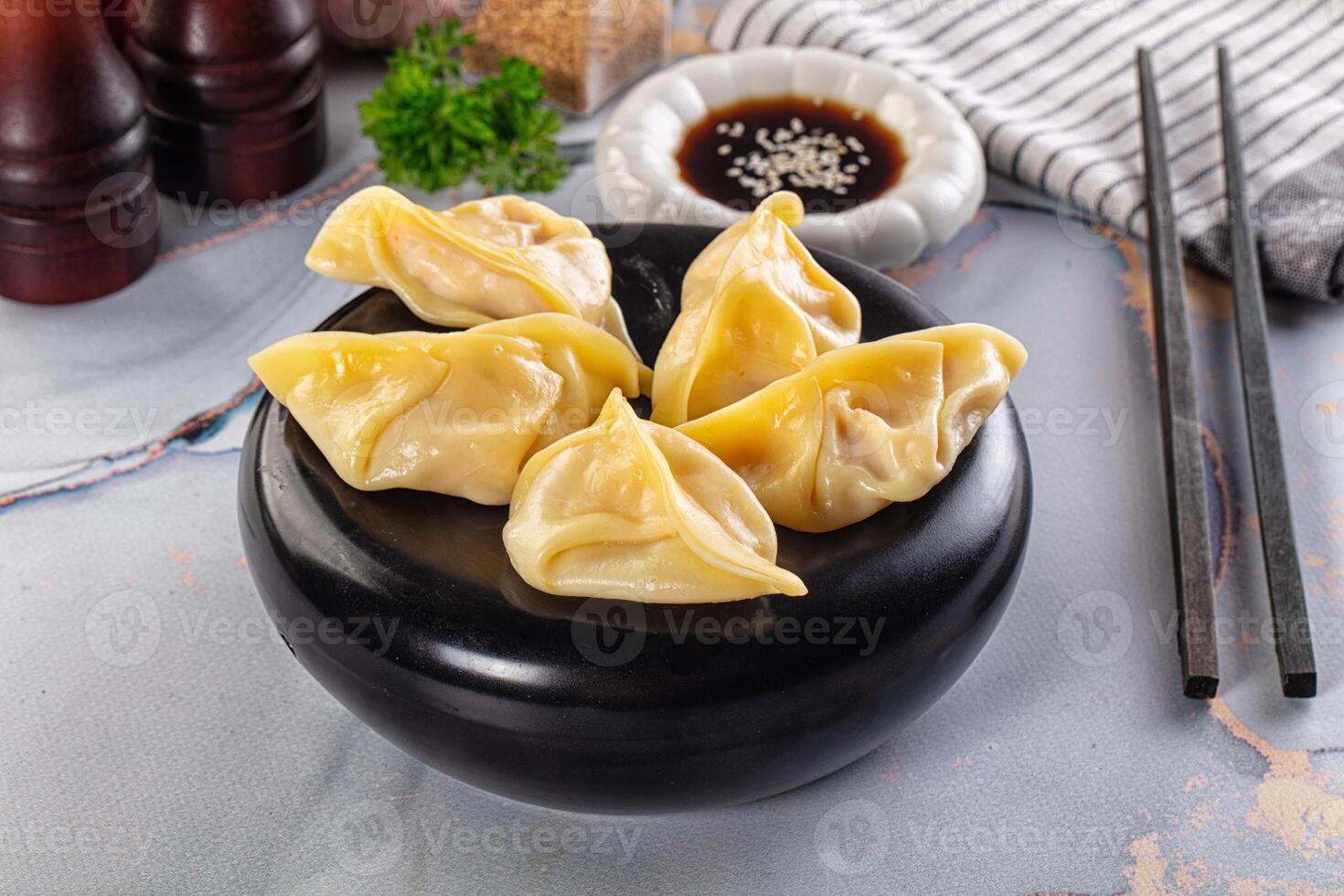 Dumplings in a bowl on a table photo