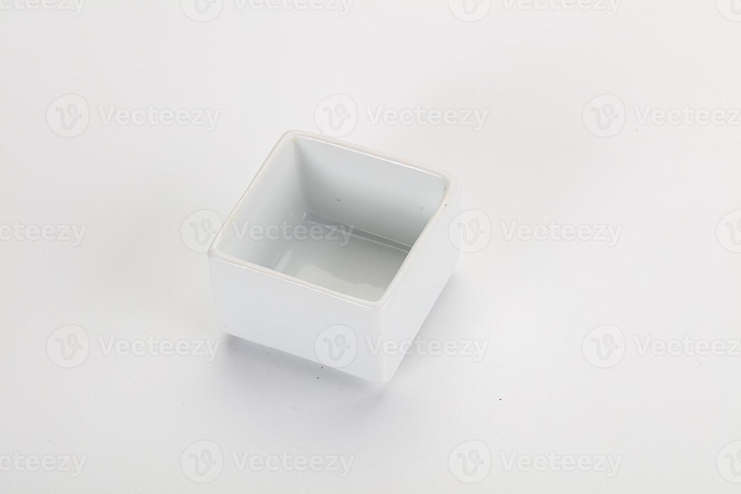 A white square container with a small hole in it photo