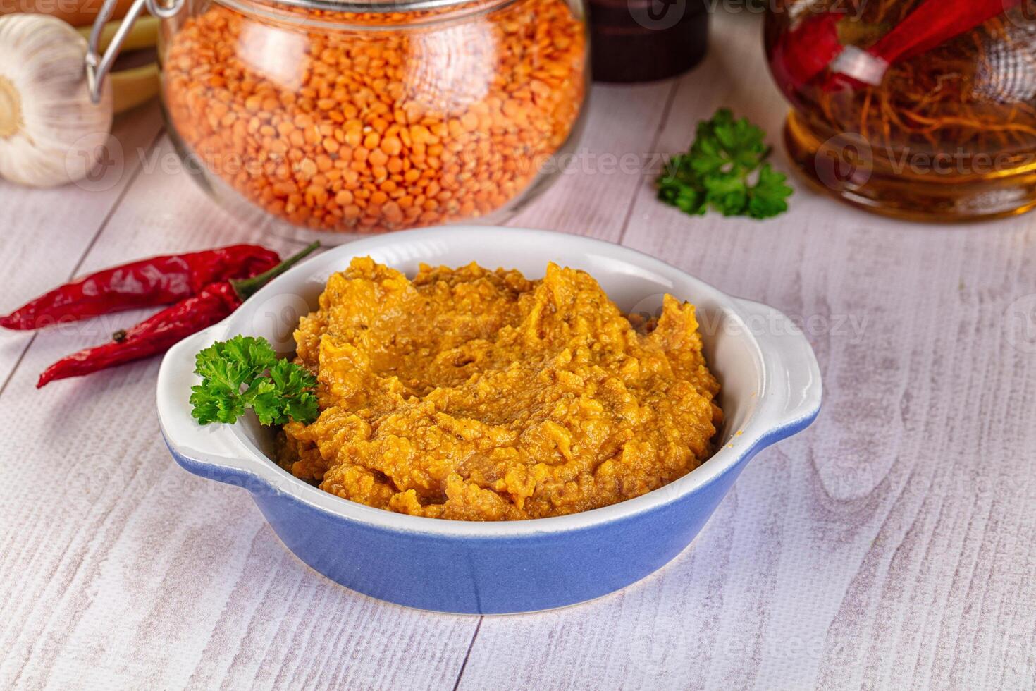 A bowl of mashed potatoes with spices and herbs photo