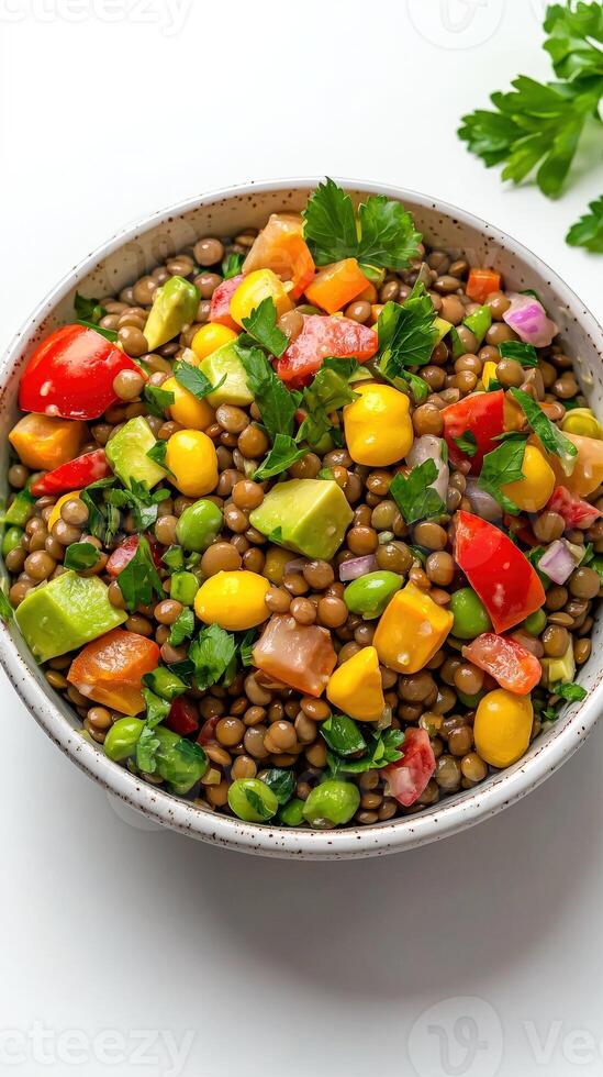 A bowl of mixed vegetables and tomatoes on a white background photo