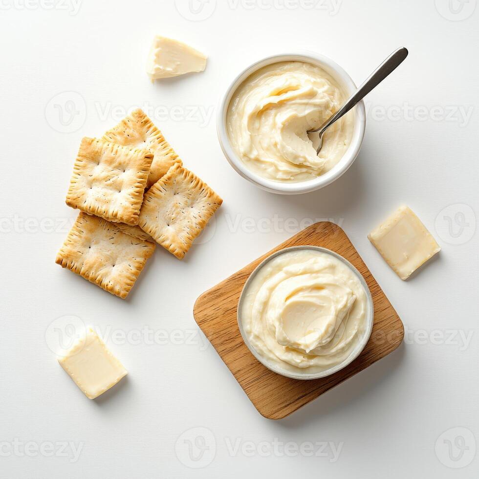 Butter spread on crackers and crackers photo