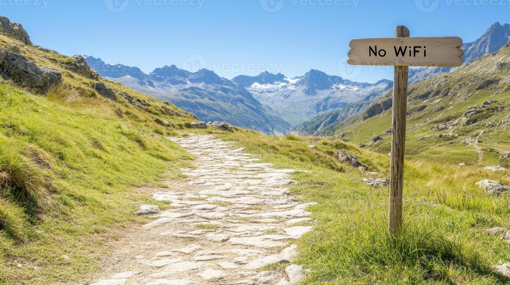 A scenic stone path leads through mountains with a sign stating No WiFi, perfect for a tech-free escape into nature photo