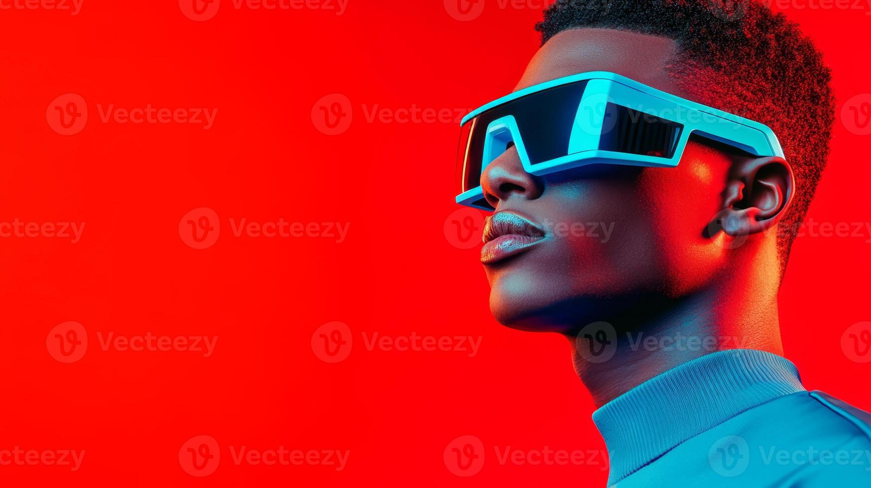 A man in blue glasses and minimalist clothes stands confidently in a vibrant red space, radiating energy and creativity photo