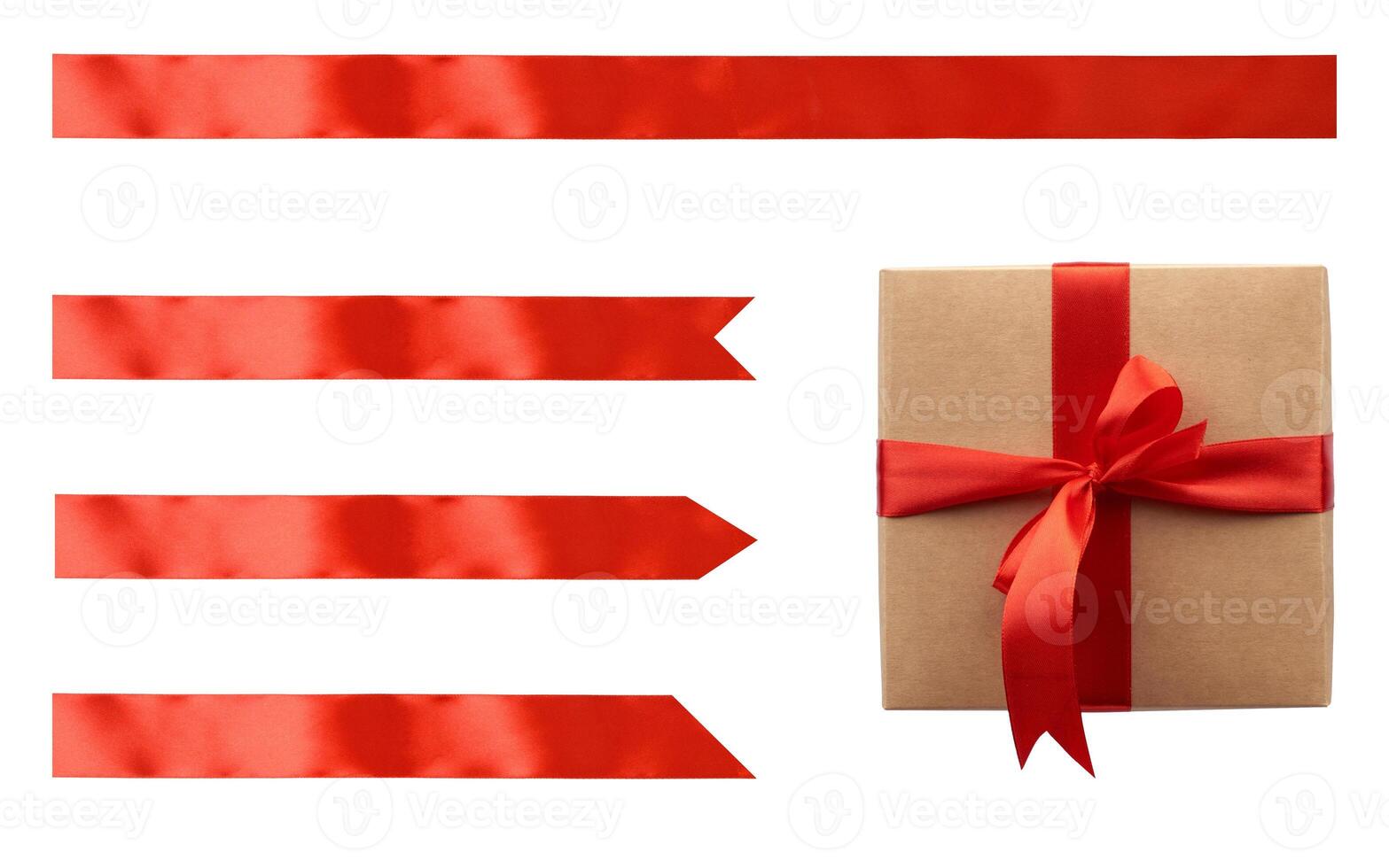Kraft paper gift box tied with red satin ribbon with bow and set of red ribbons of different shapes on isolated background photo