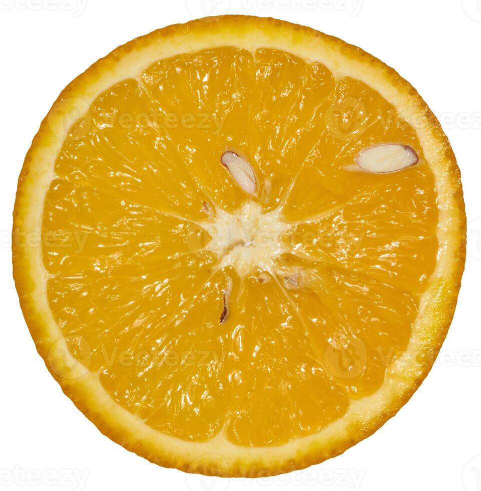A round cross-section of a bright orange orange with segments and several seeds visible. photo