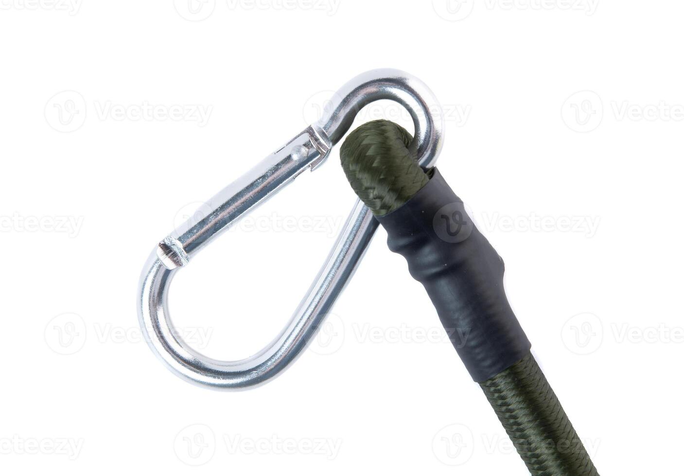 Close-up of a metal carabiner attached to a green elastic bungee cord on a white background. Durable tie down strap for automotive and outdoor use. photo