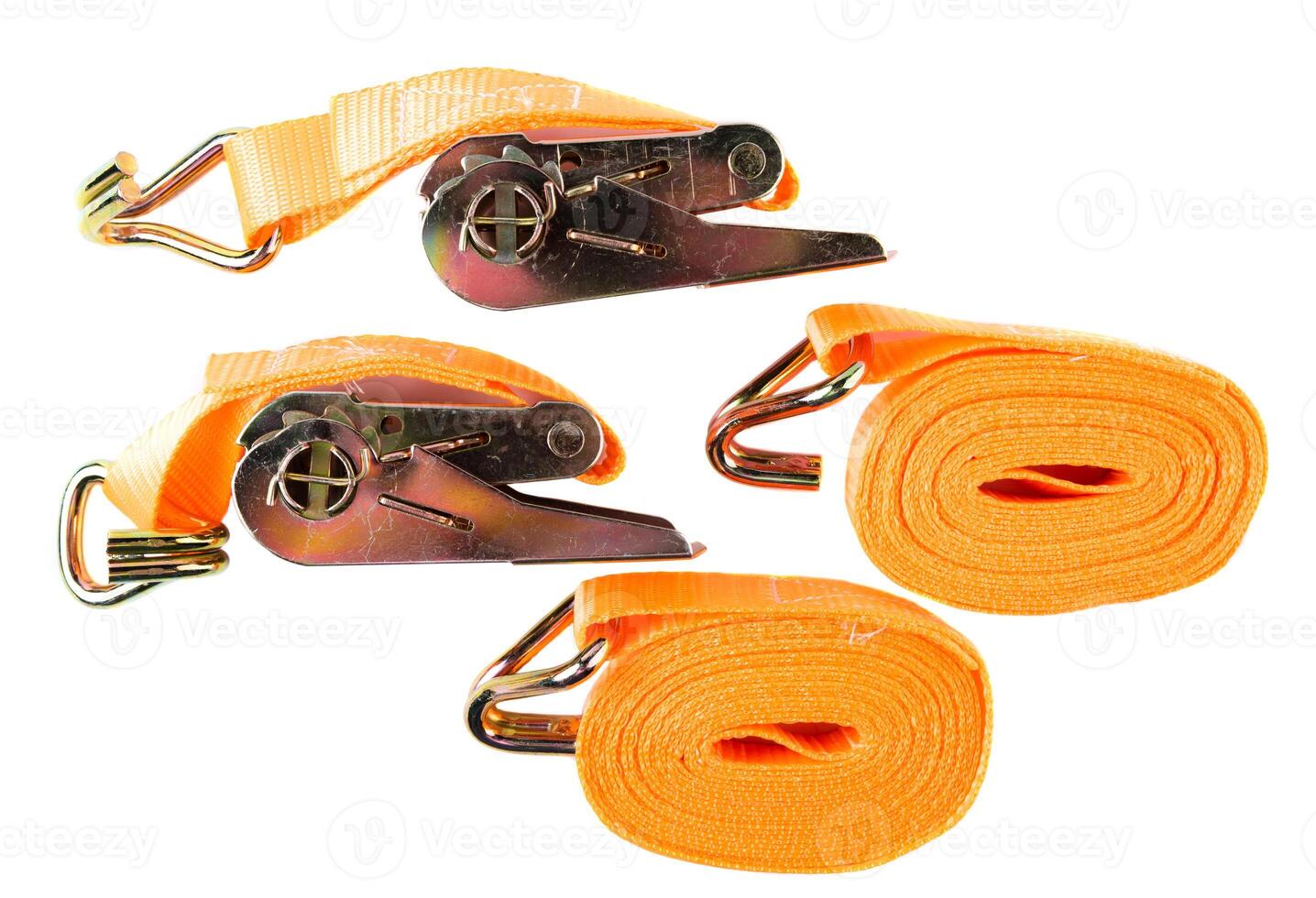 Top view of two coiled orange cargo straps and two ratchets with hooks, arranged on white background. Clean product layout for catalog or store listing. photo