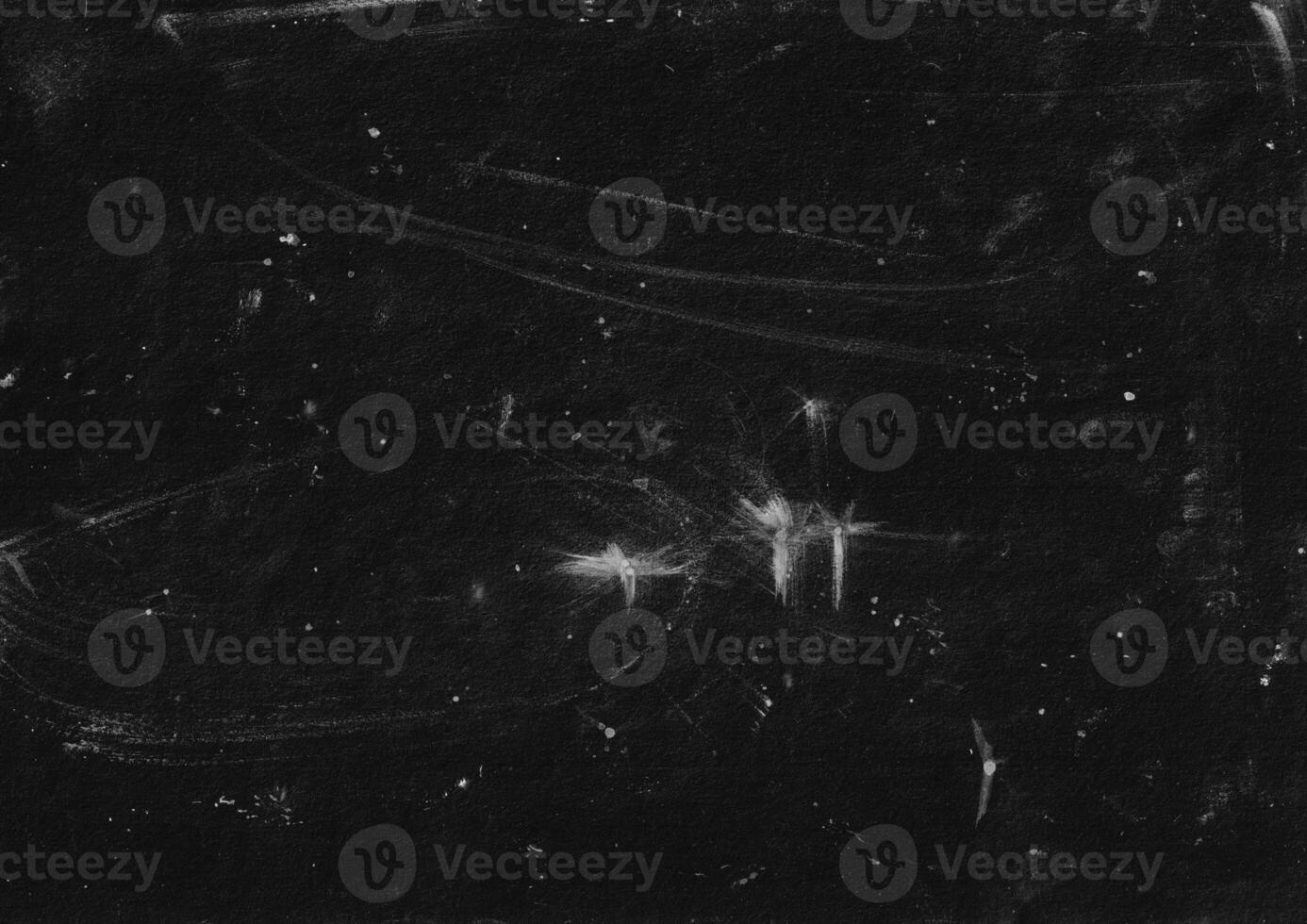 Dark grunge background with dust and scratches. Abstract rough surface backdrop. White stain on dark. Suitable for poster, banner, or cover overlay. photo