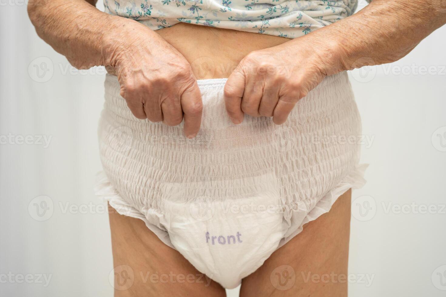 senior woman patient wearing adult incontinence diaper pad photo