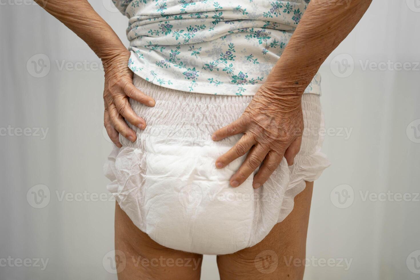 senior woman patient wearing adult incontinence diaper photo