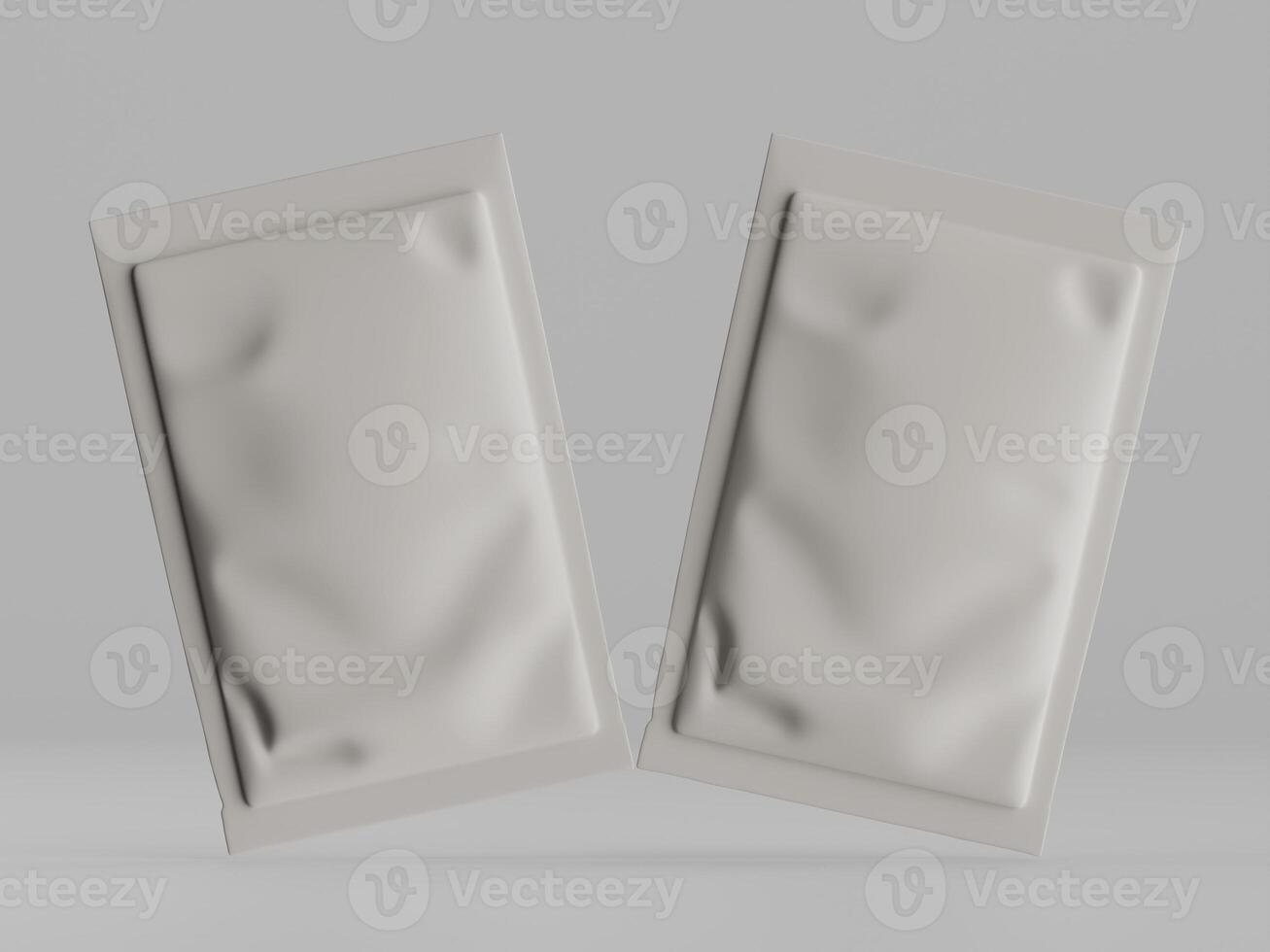 Two white packets of pills on a gray background photo
