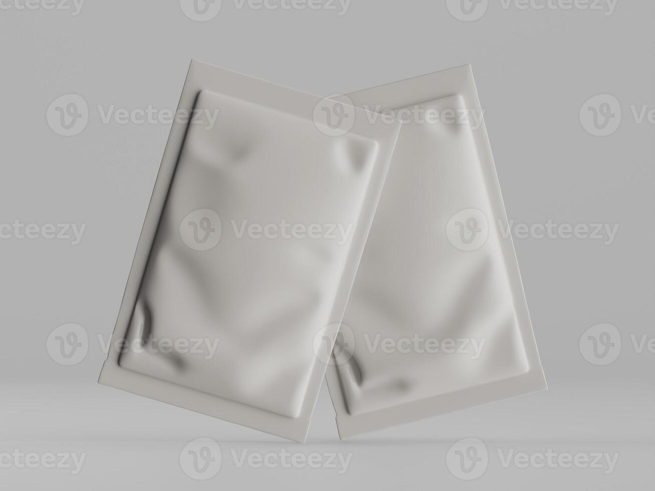 Two white packets of medicine on a gray background photo