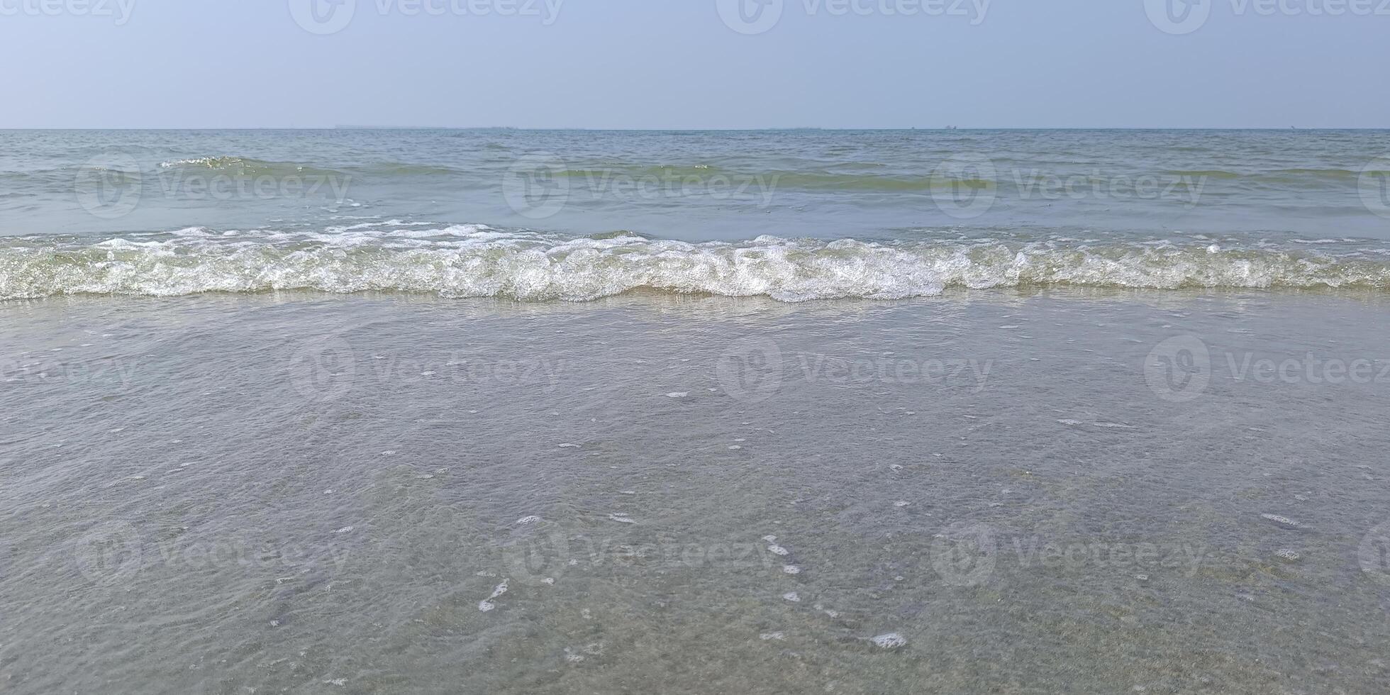 Calm sea water wave motion. Sky and waves on beach, background tourist attractions, relaxation photo