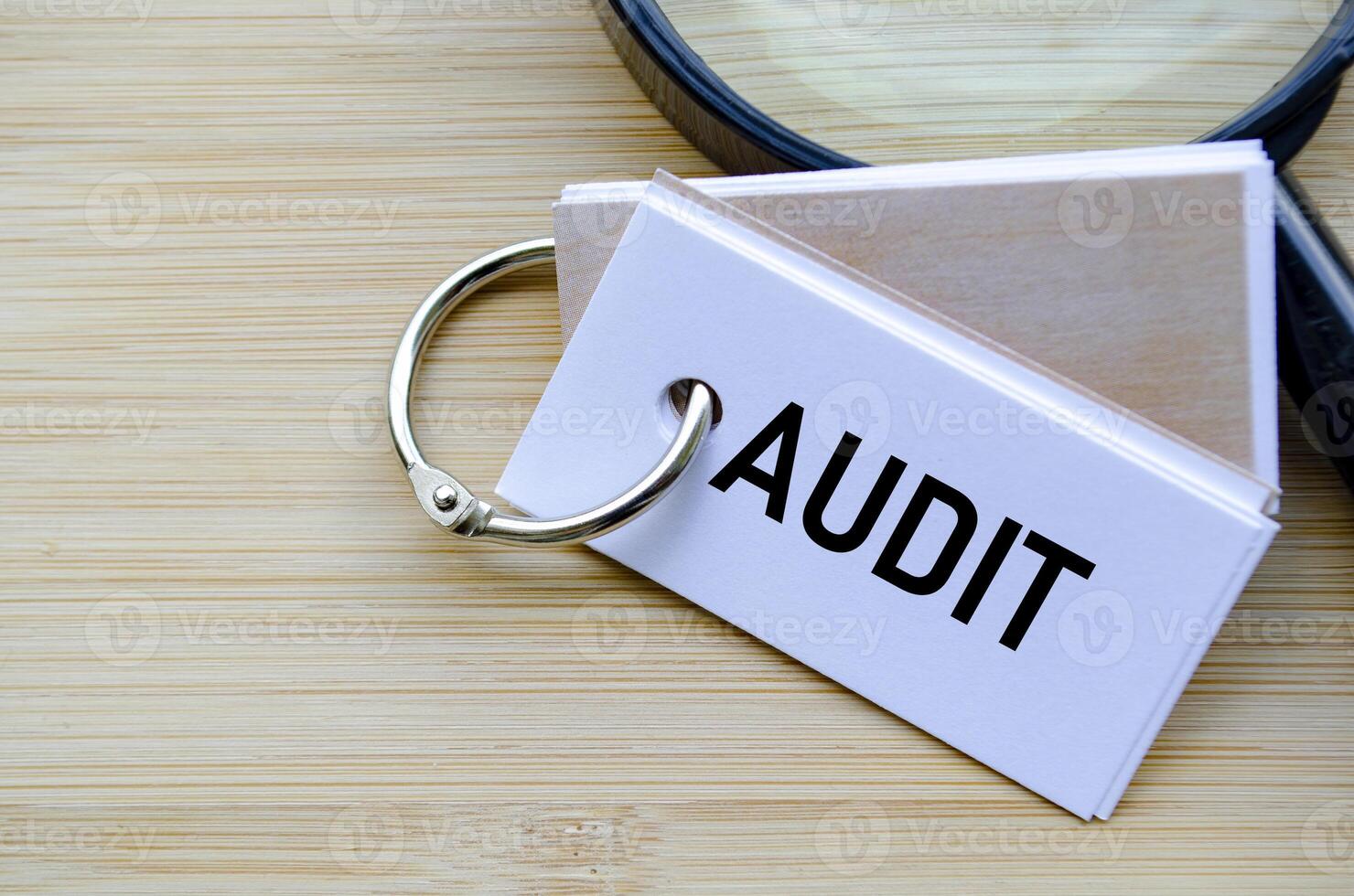 Audit text on notepad symbolizing financial review and compliance evaluation photo
