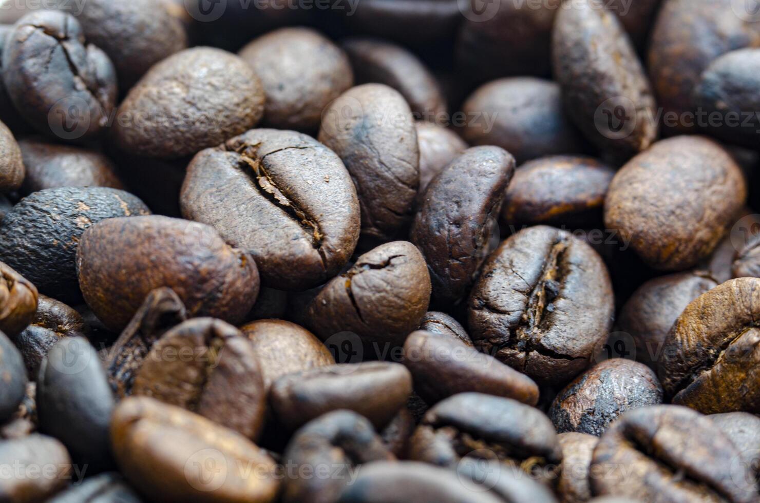 Close up of roasted coffee beans with customizable space for text. photo