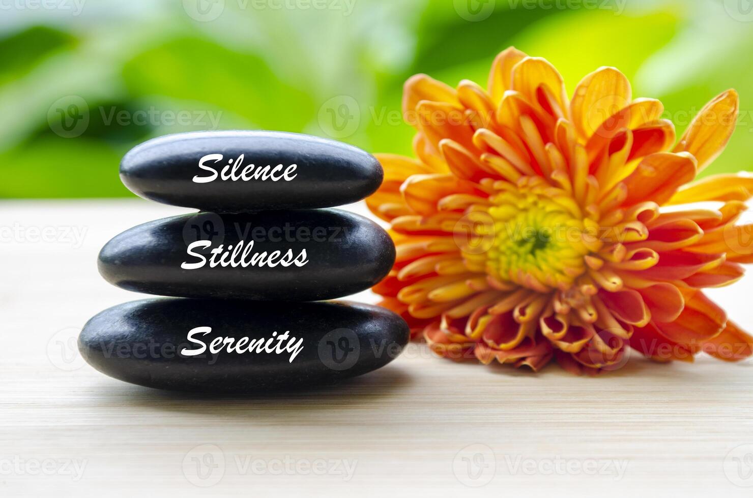 Close up view of Silence, Stillness and Serenity text on Zen stones. Inner peace concept photo