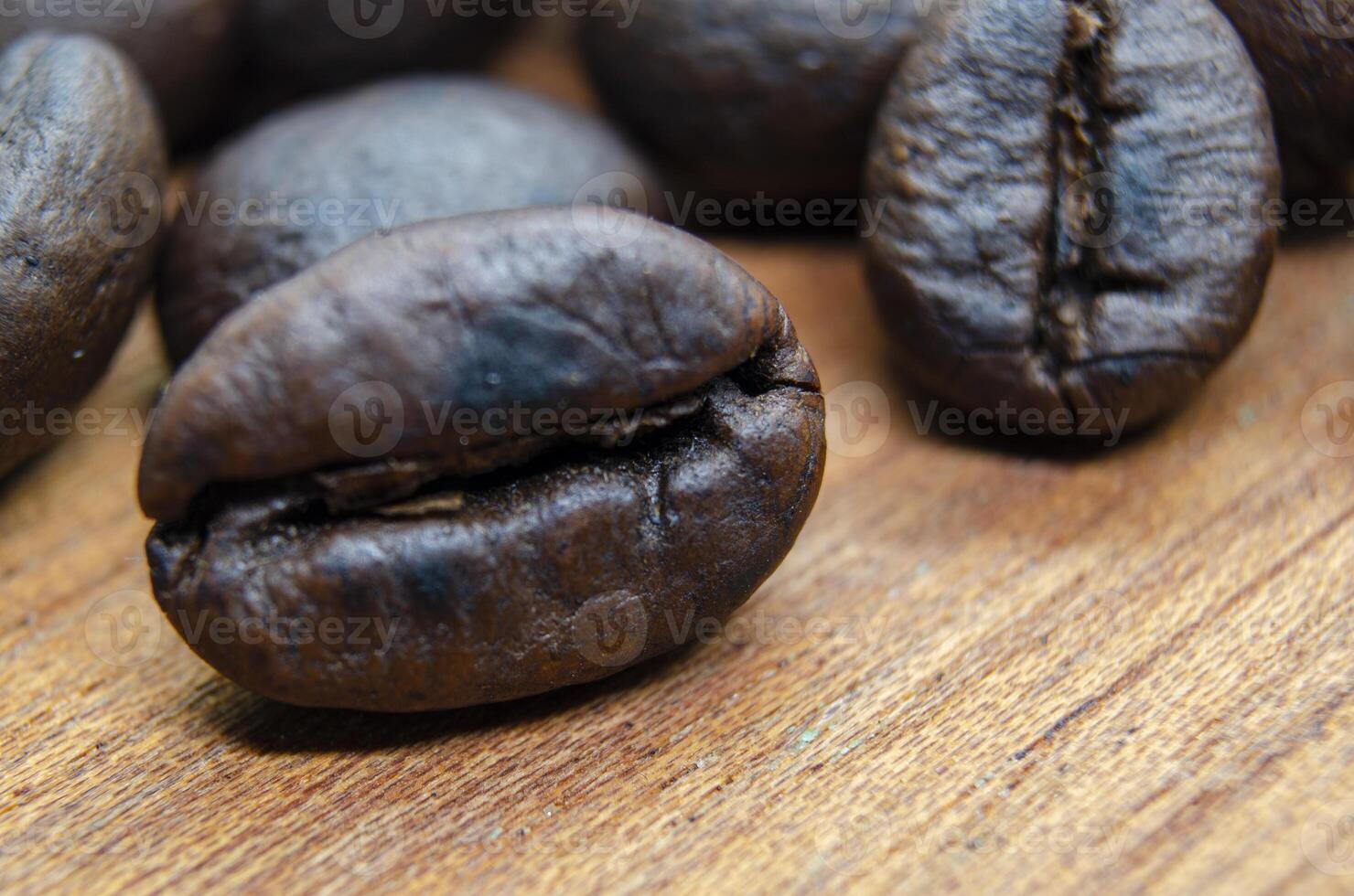 Close up of roasted coffee beans that highlights the texture and surface details of the coffee beans. Coffee beans concept photo