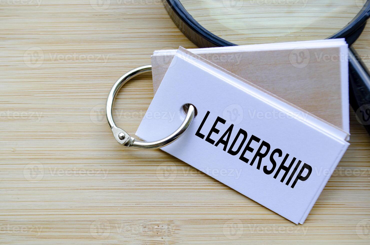 Leadership text on notepad highlighting the core of organizational direction and influence photo