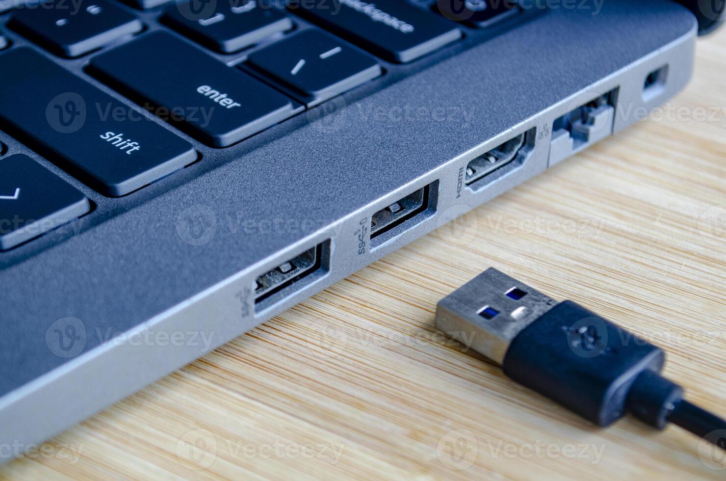 USB plugged into high speed port symbolizing convenience and cyber risk trade off photo