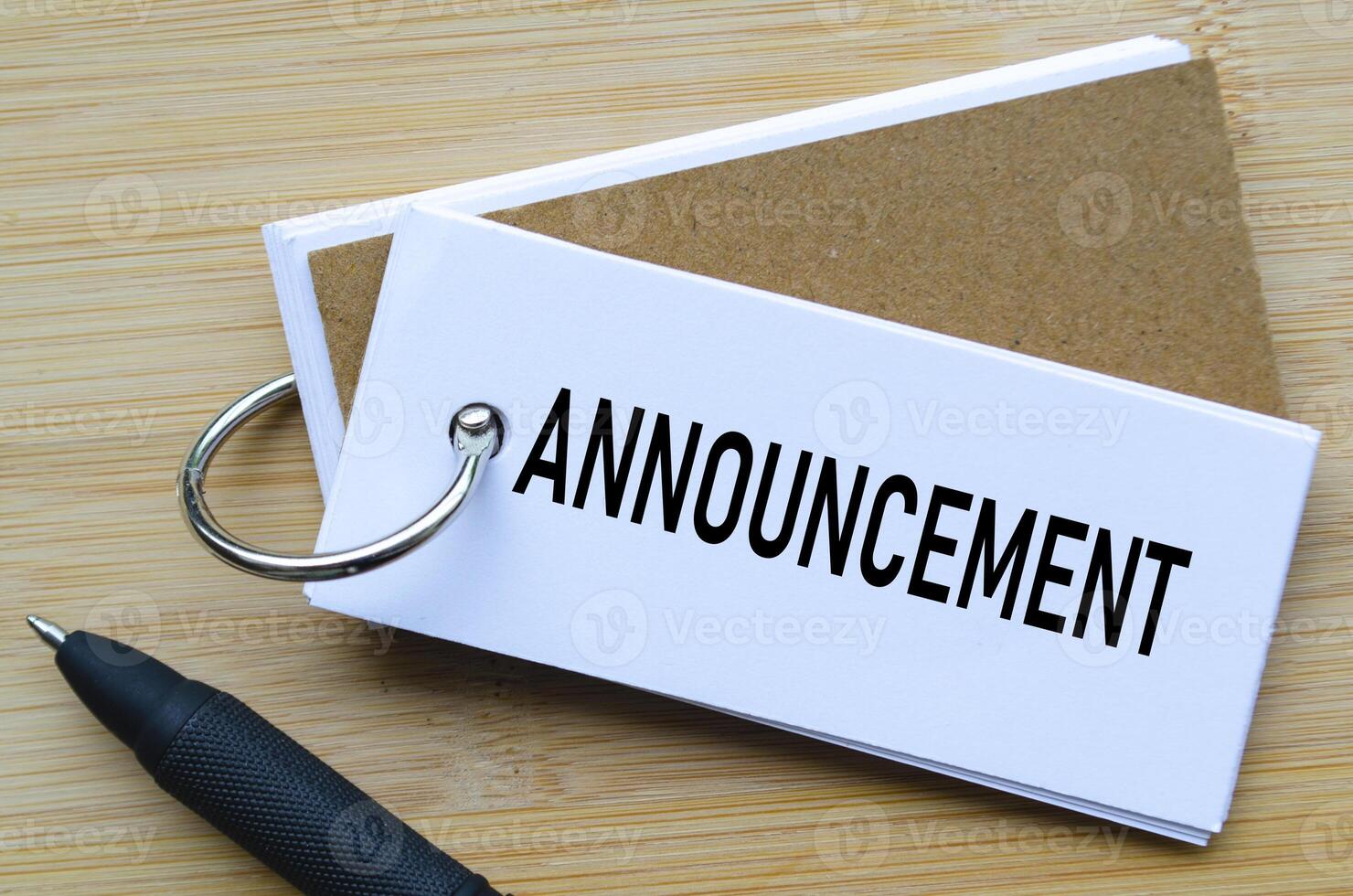 Announcement text on notepad indicating official news or internal communication photo