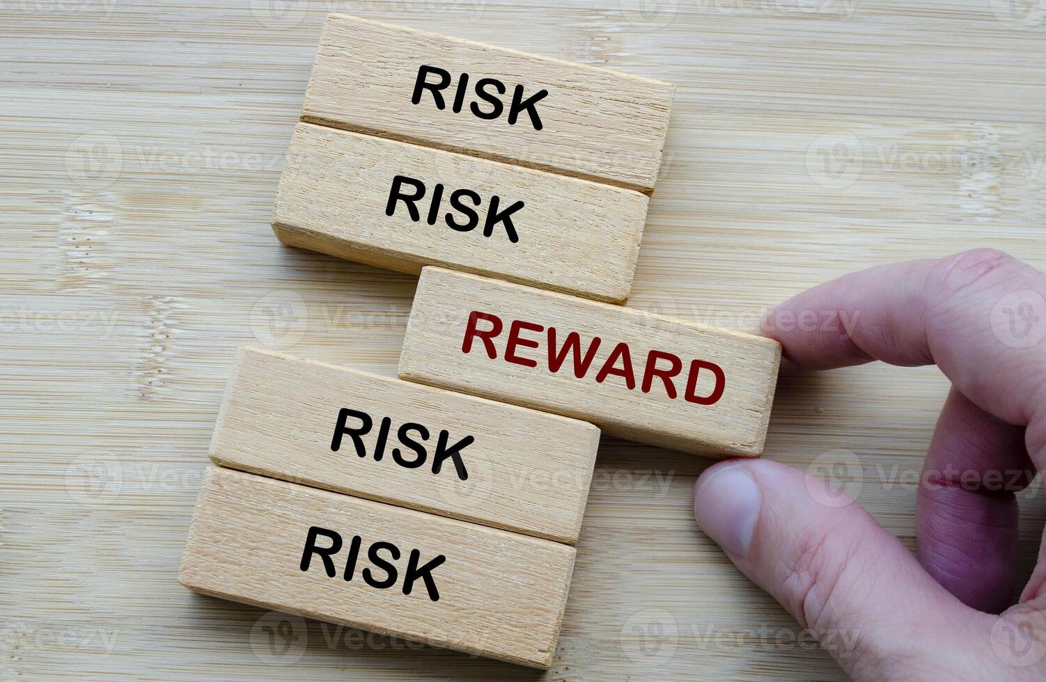 Risk and Reward text, depicting the classic decision making dilemma of weighing risk against reward in any venture photo