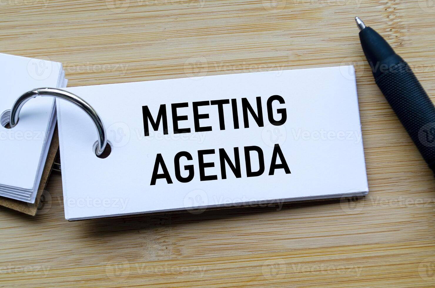 Meeting Agenda text on notepad illustrating structured planning and organized discussion points photo