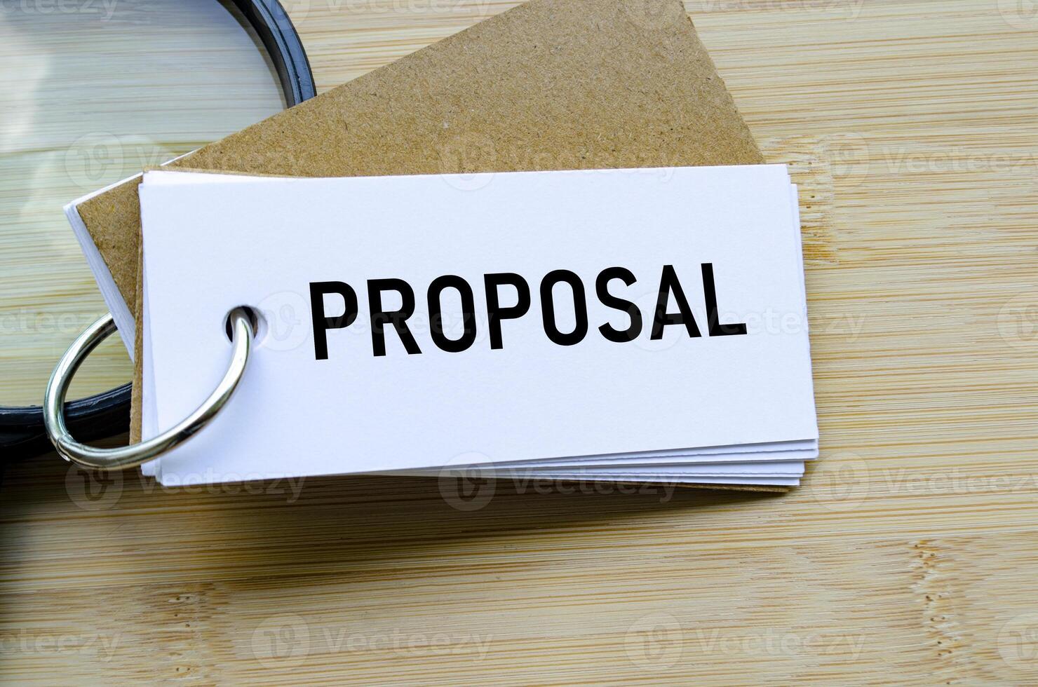 Proposal text on notepad denoting submission of ideas, business bids, or plans photo