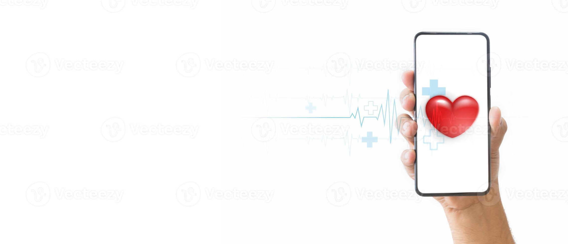 A hand holding a smartphone with a red heart and a medical heartbeat line on the screen, symbolizing health and love. Digital health concept. Mobile health technology for healthcare applications. photo