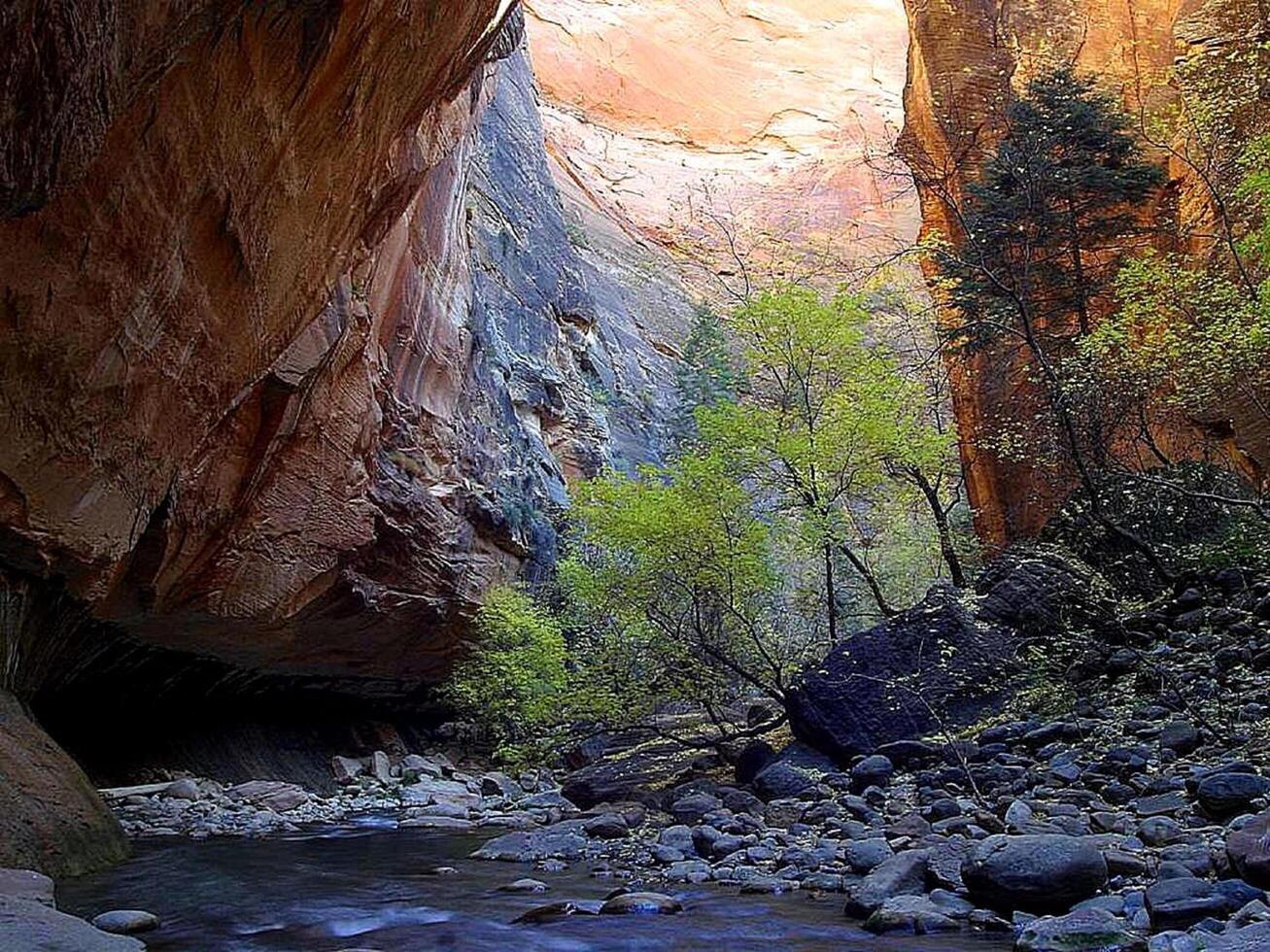 a river runs through a canyon in the middle of a rocky landscape photo