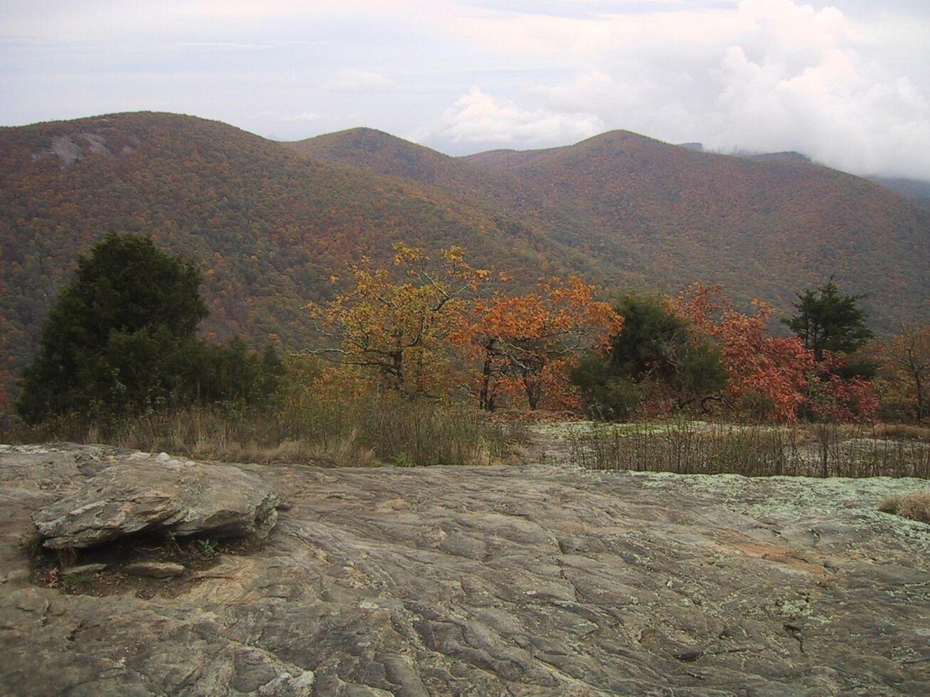a view of the mountains from a rocky outcropping photo