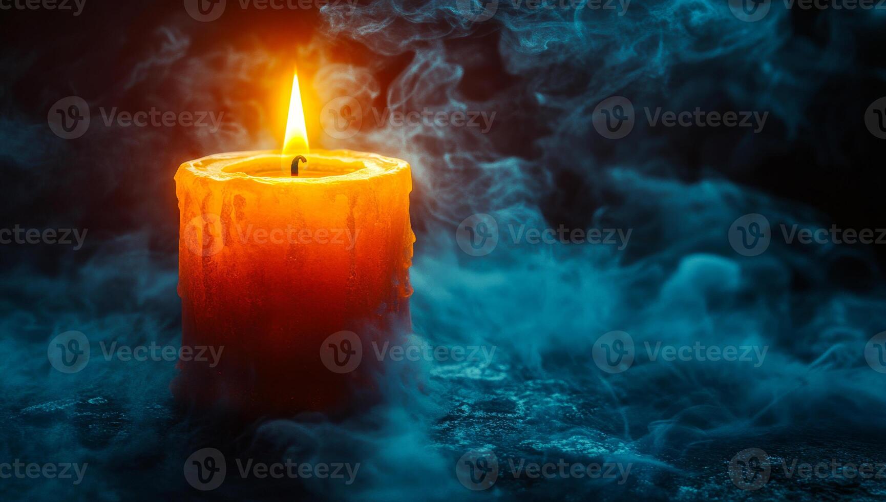 Glowing candle in dark smoke. A bright orange candle burns steadily amidst swirling blue smoke, creating an atmospheric and mystical ambiance. photo