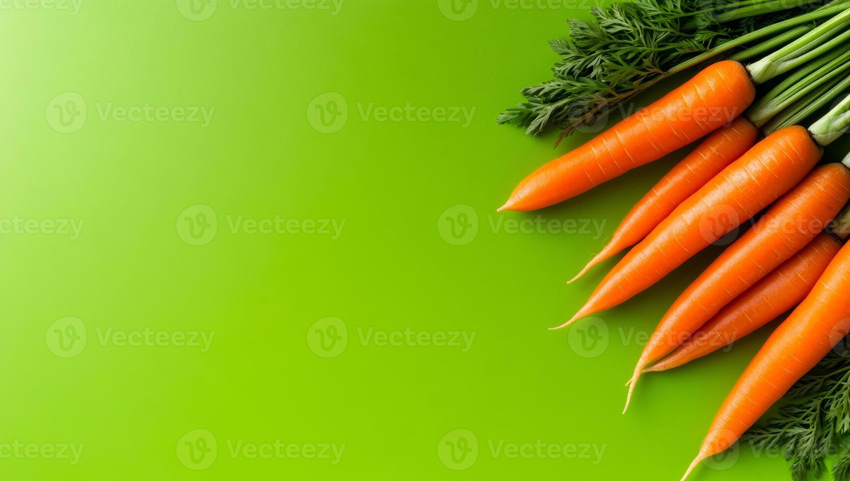 Carrots on green background. Vibrant orange carrots with green tops are neatly displayed on a lively green surface, highlighting their freshness. photo