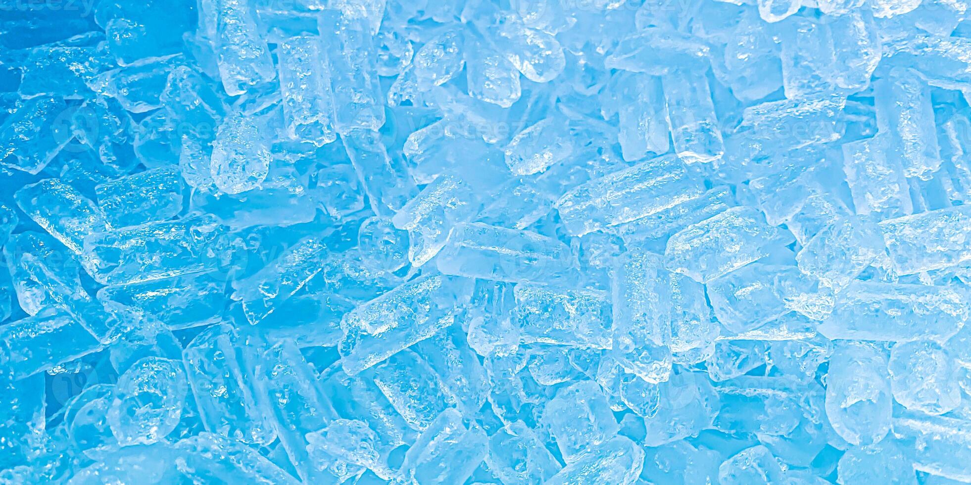 Close-up view of crushed ice with a frosty, cold blue tone, creating a refreshing and cool visual effect. photo