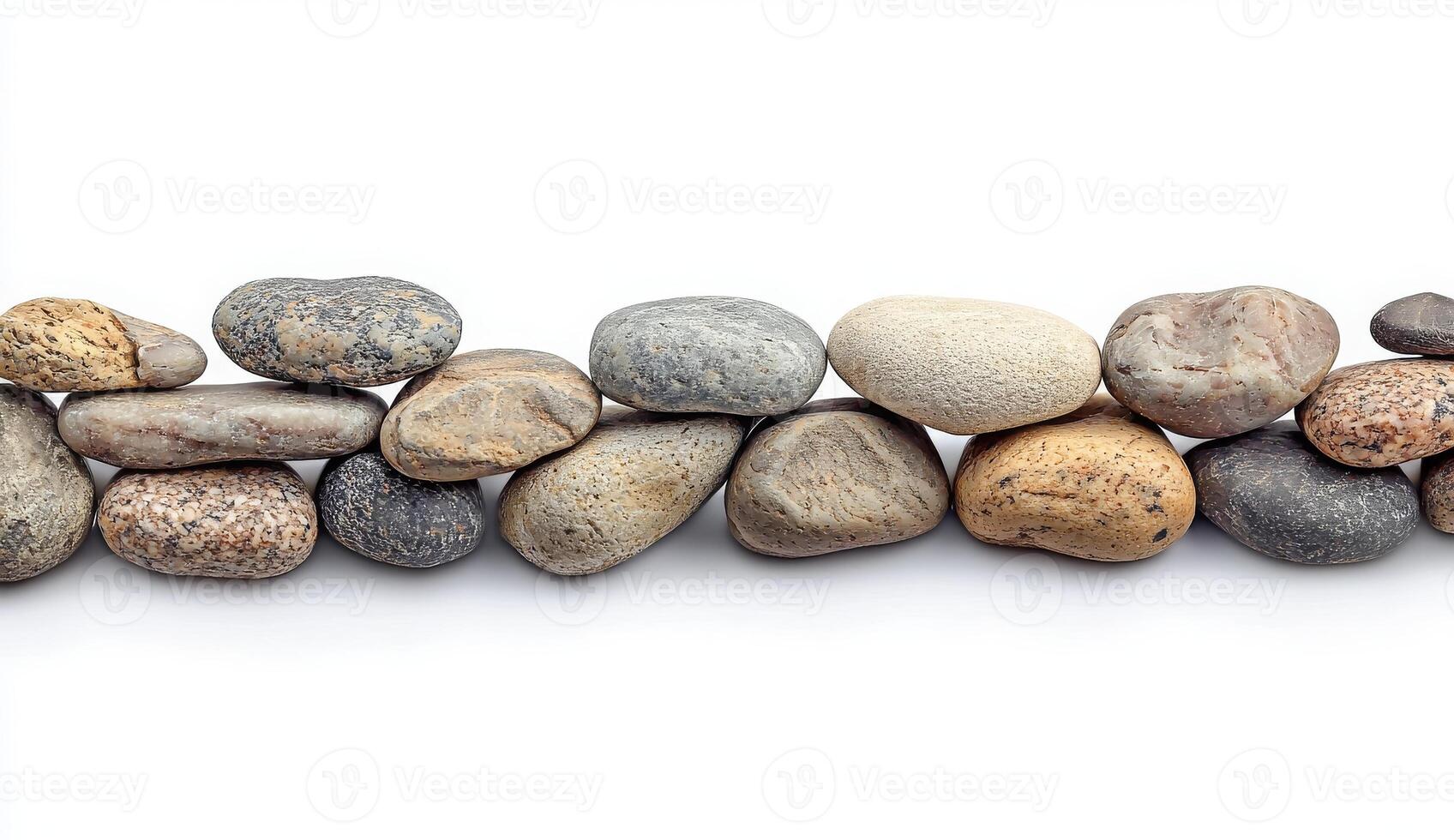 Smooth River Stones Lined Up on White Background for Decorative Use photo