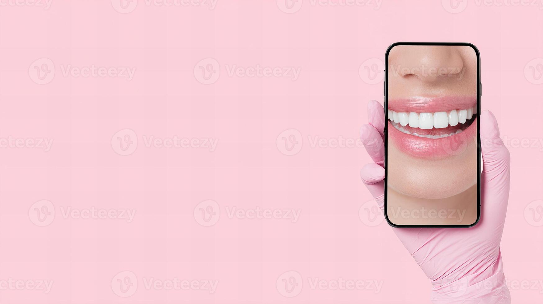 A person holding up a phone with a smiley face on it photo