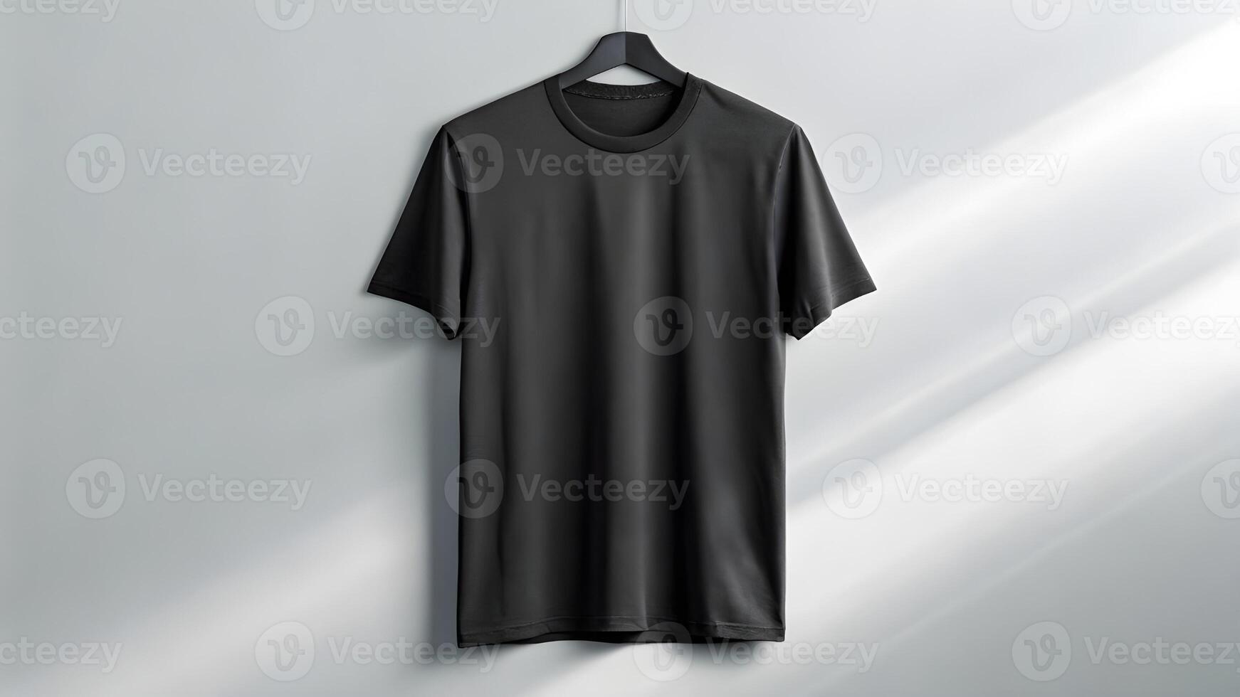 Black t - shirt hanging on a wall photo