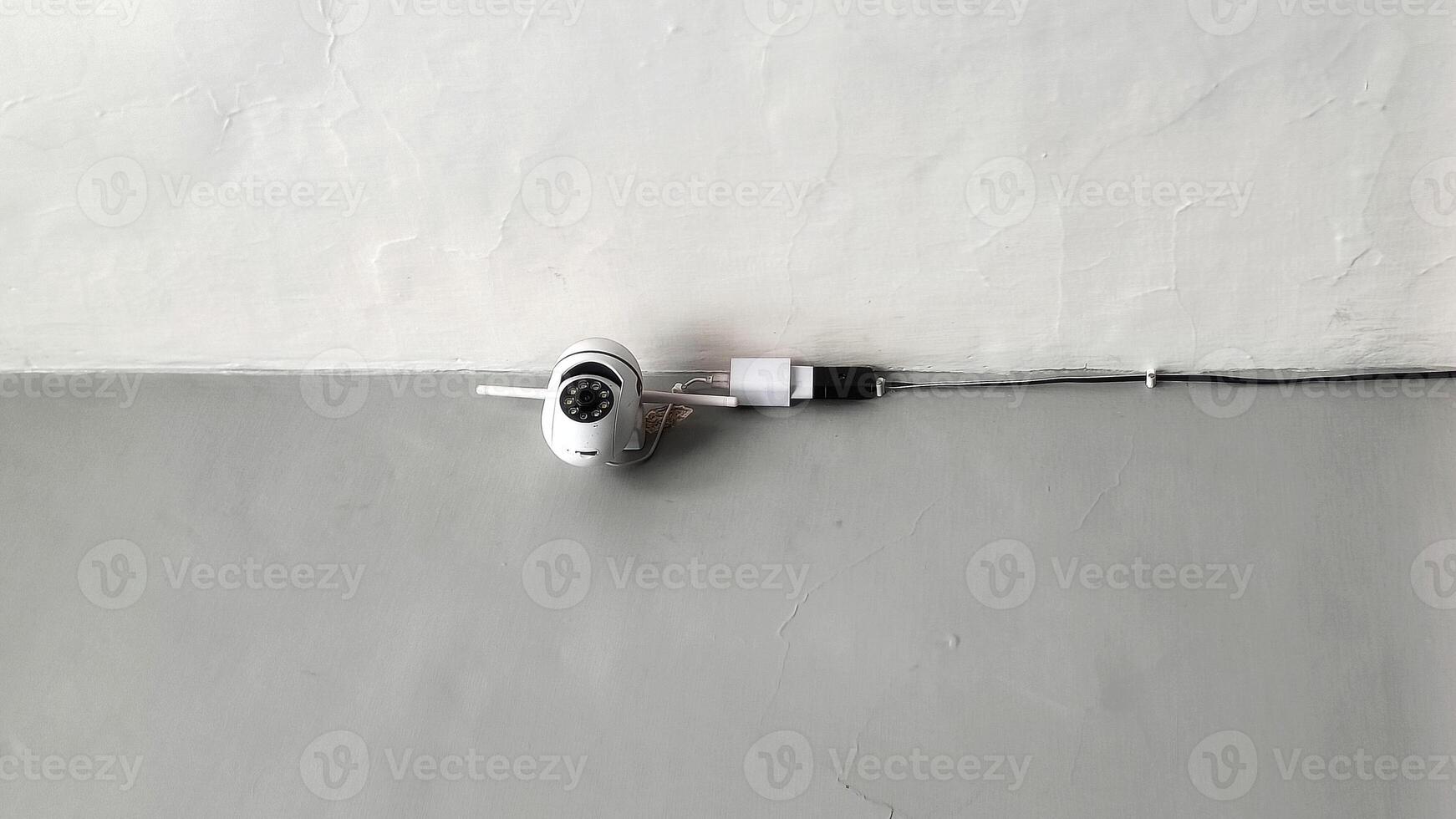 CCTV surveillance system on white and gray walls photo