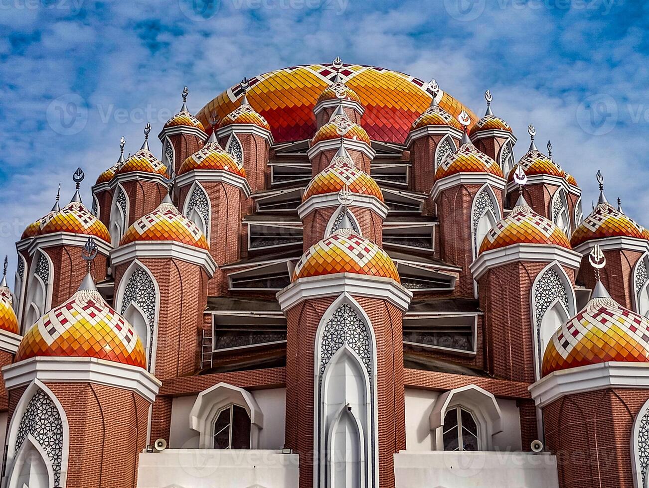 Majestic Mosque with Colorful Domes. The 99 Dome Mosque or better known as the Asmaulhusna Mosque is a mosque in Makassar City, South Sulawesi Province, Indonesia. photo