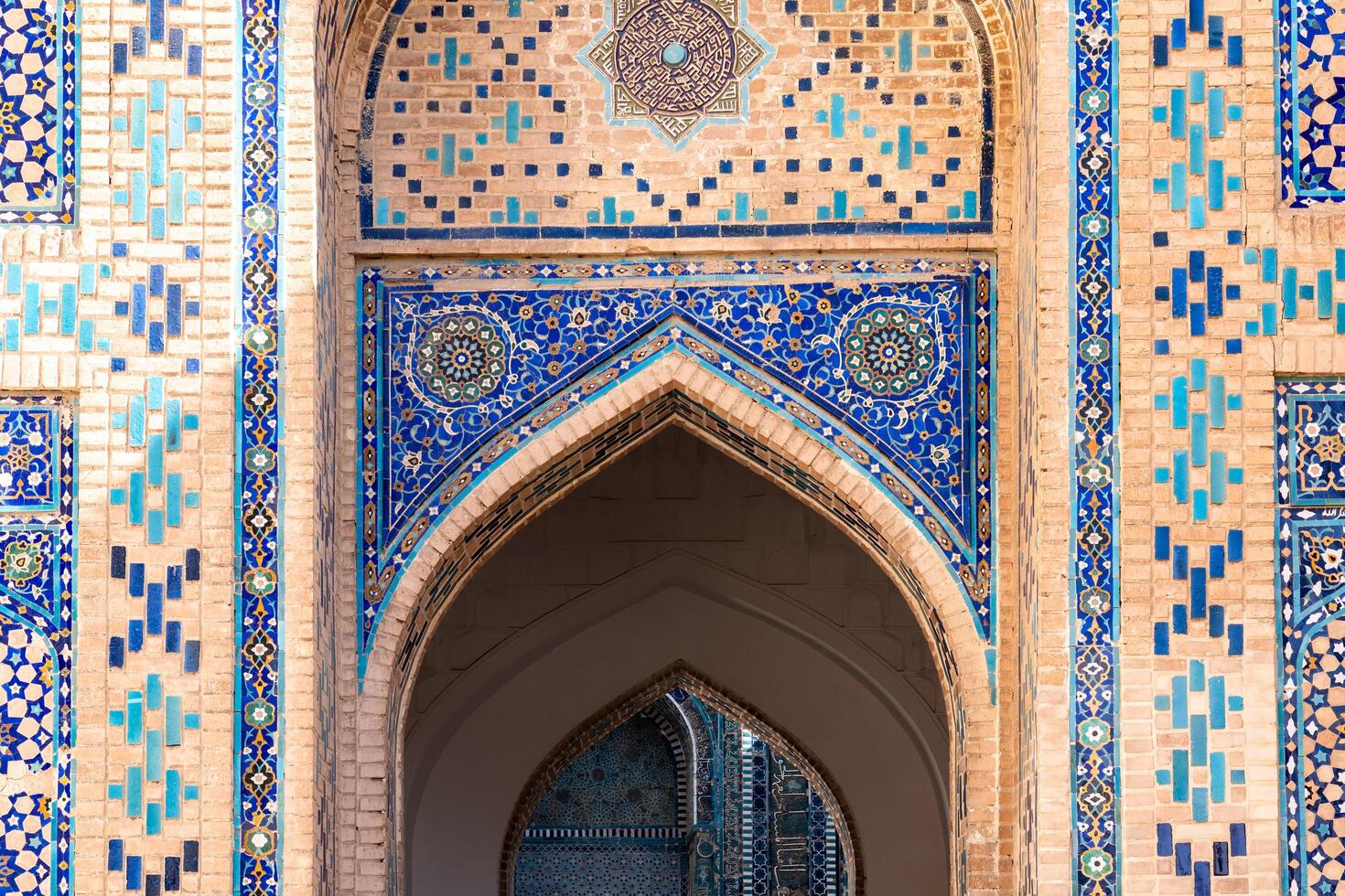Samarkand, Uzbekistan - august 13, 2023-Particular of Shakhi Zinda necropolis, a famous mausoleum complex in Samarkand during a sunny day photo