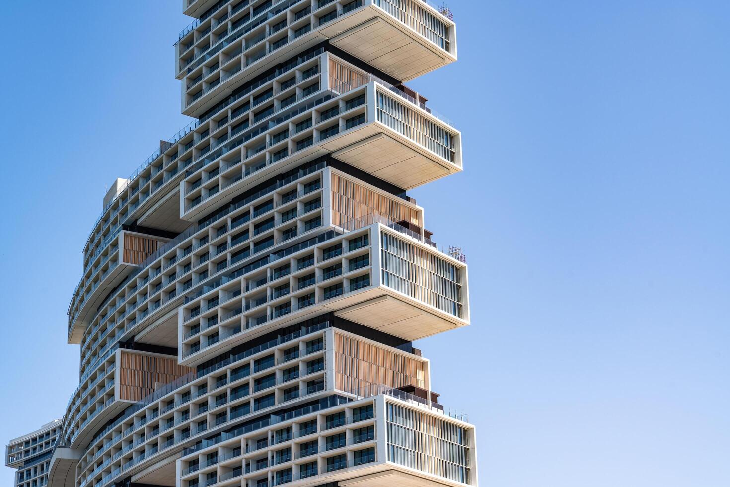 Dubai, United Arab Emirates-March 17, 2023-particular of the architecture of the hotel Atlantis The Royal at Palm Jumeirah during a sunny day photo