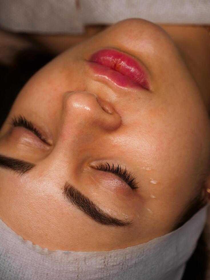 woman getting a facial treatment photo