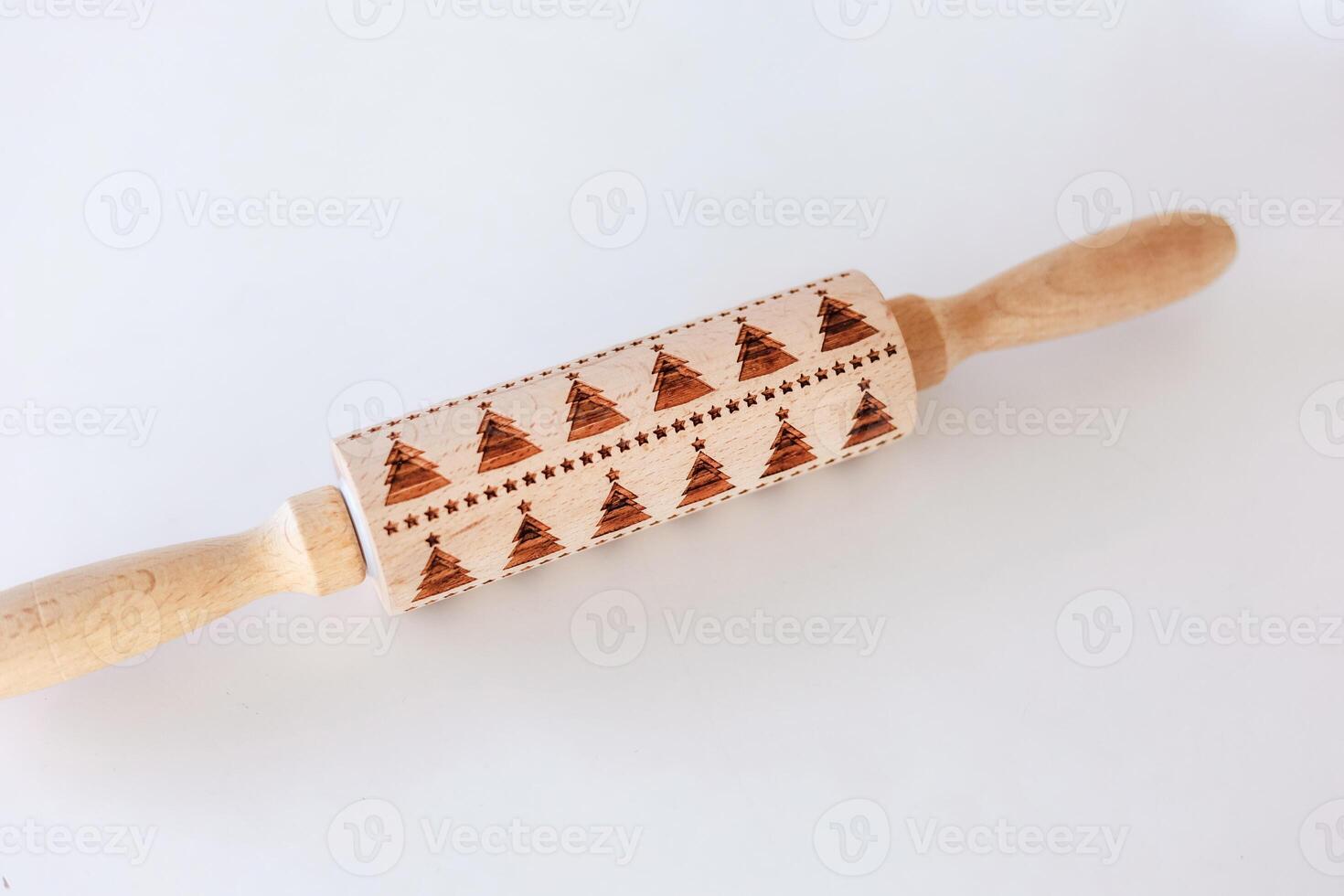 Unique wooden rolling pin with intricate patterns for baking projects and culinary creativity photo