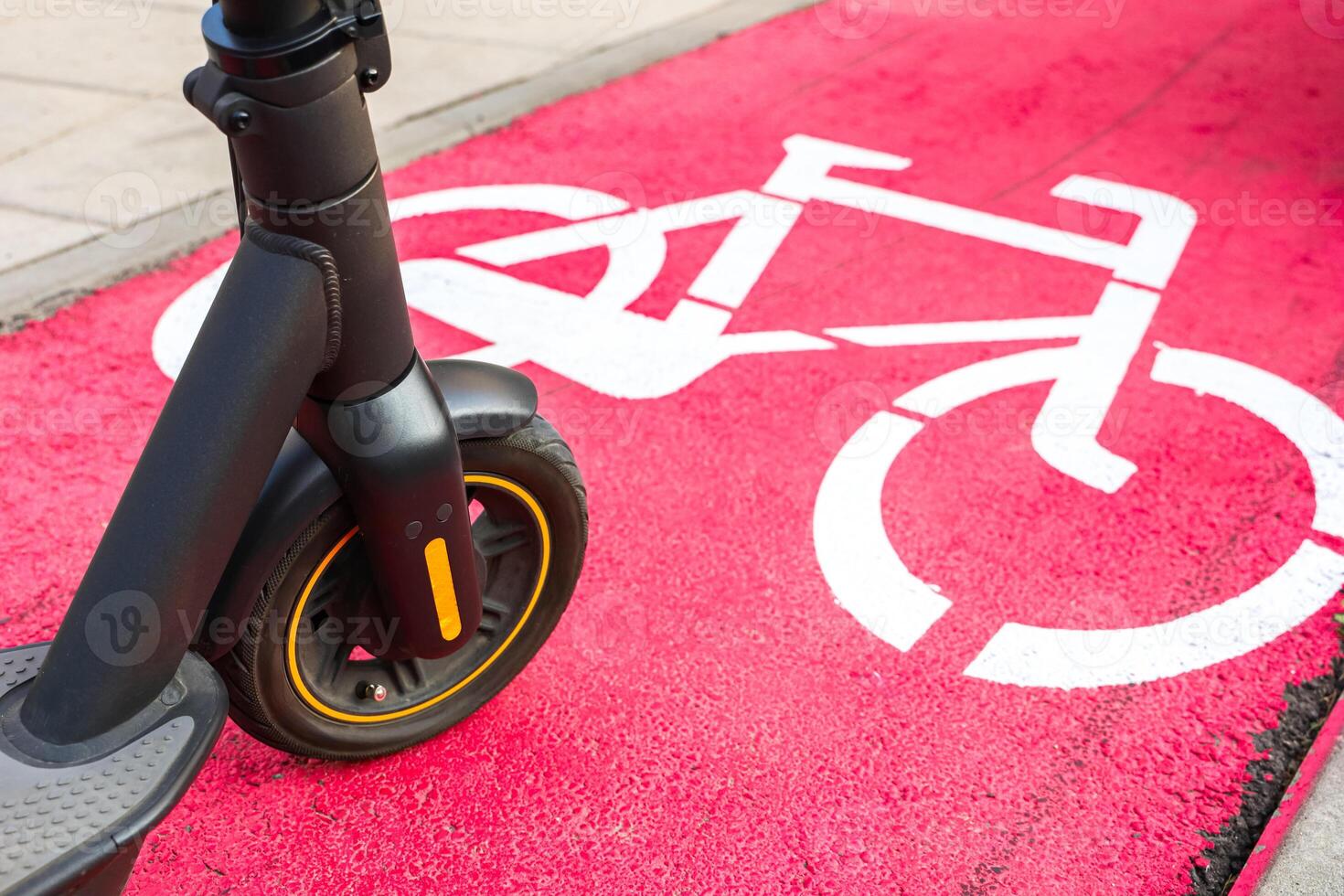 Electric scooter on bike lane in urban park during daytime photo