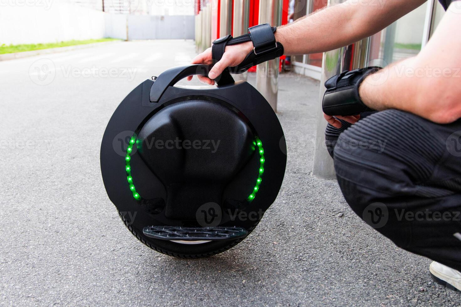 One wheel electric unicycle parked on a city street during daylight hours photo
