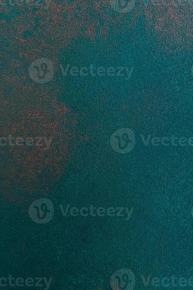 Vibrant teal texture with subtle gradients observed in natural light photo