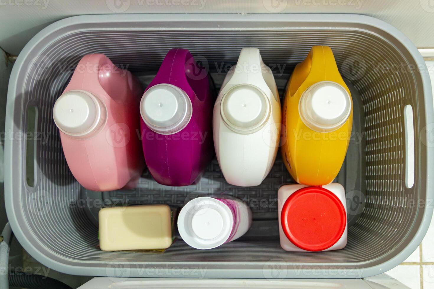 A plastic container filled with different colored containers photo